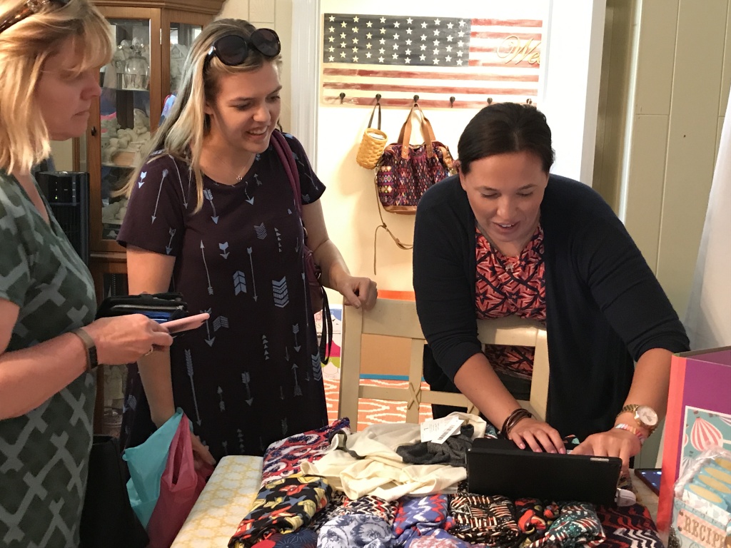 LuLaRoe Cassandra Carillo rings up a sale using an app on her iPad.