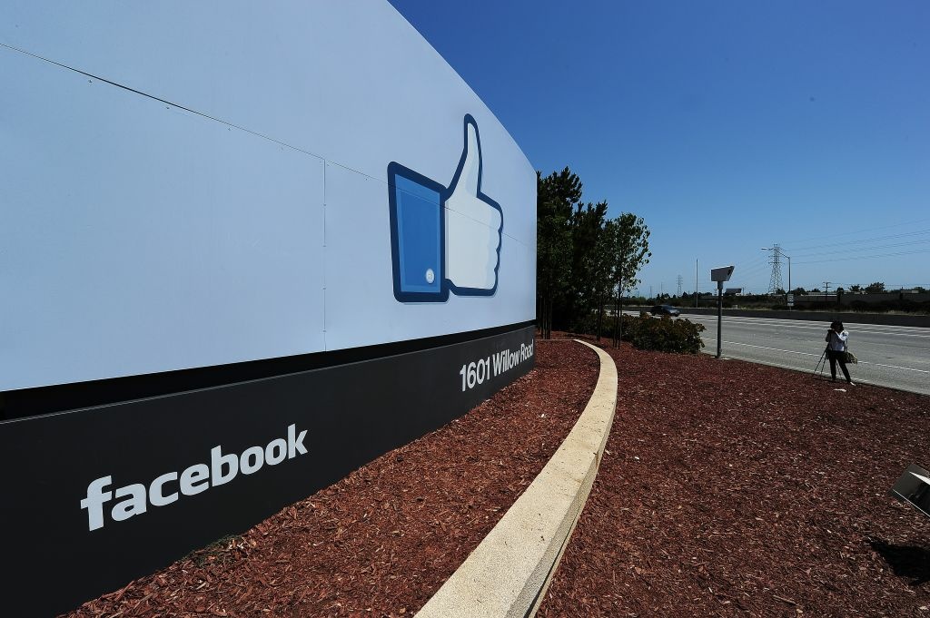A woman shoots video of the sign at the entrance to the Facebook main campus in Menlo Park, California A woman shoots video of the sign at the entrance to the Facebook main campus in Menlo Park, California, May 15, 2012.