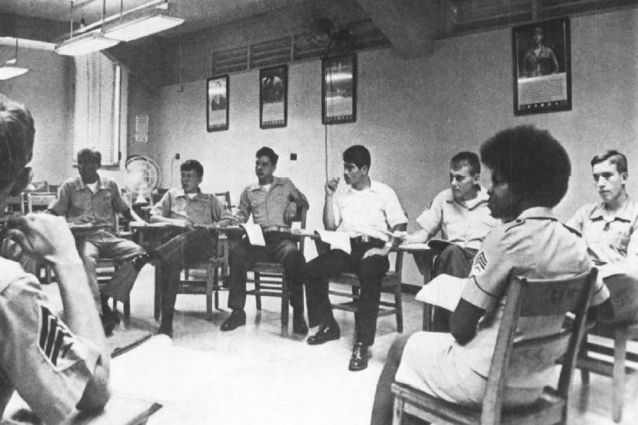 American Homefront Riot Sergeant Brenda Good (foreground), a human relations instructor, guides a discussion group of Marines in the early 1970s. The Marine Corps said the mandatory seminars were intended to 'develop understanding and tolerance of each others' background and point of view.'