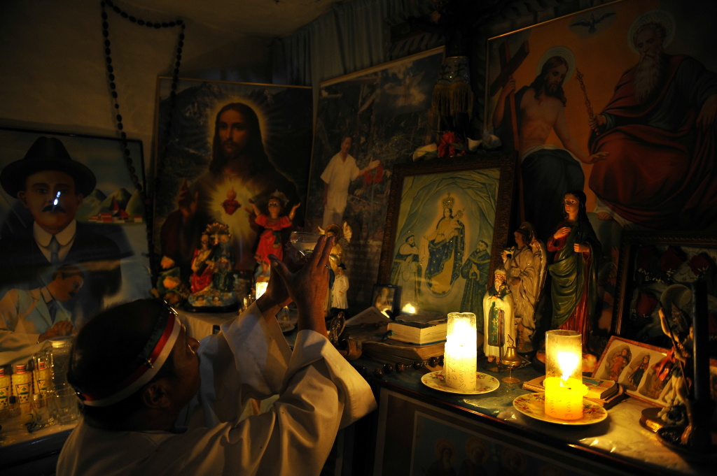 COLOMBIA-BELIEF-EXORCISM-RITUAL Hermes Cifuentes, 50, aka Brother Hermes, prepares for an exorcism on June 1, 2011, in La Cumbre, Valle del Cauca department, Colombia.
