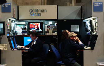 Financial professionals work in the Goldman Sachs booth on the floor of the New York Stock Exchange April 16, 2010 in New York, New York. Goldman Sachs was charged with fraud by the Securities and Exchange Commission over its marketing of a subprime mortgage product, sending its stock price sharply lower.