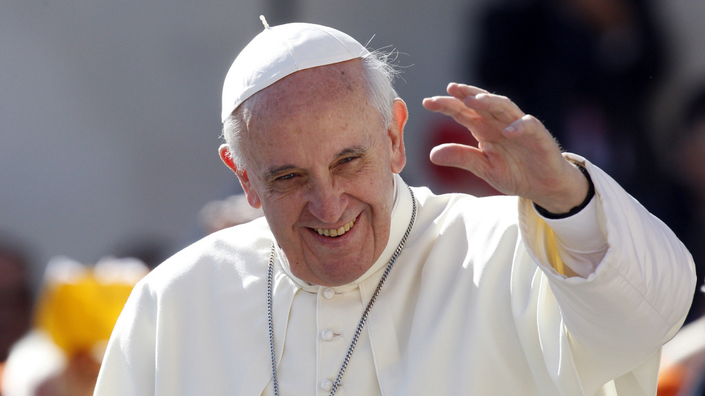 Pope Francis waves to faithful as he arrives for his weekly general audience in St. Peter's Square at the Vatican on Wednesday. Pope Francis waves to faithful as he arrives for his weekly general audience in St. Peter's Square at the Vatican on Wednesday.