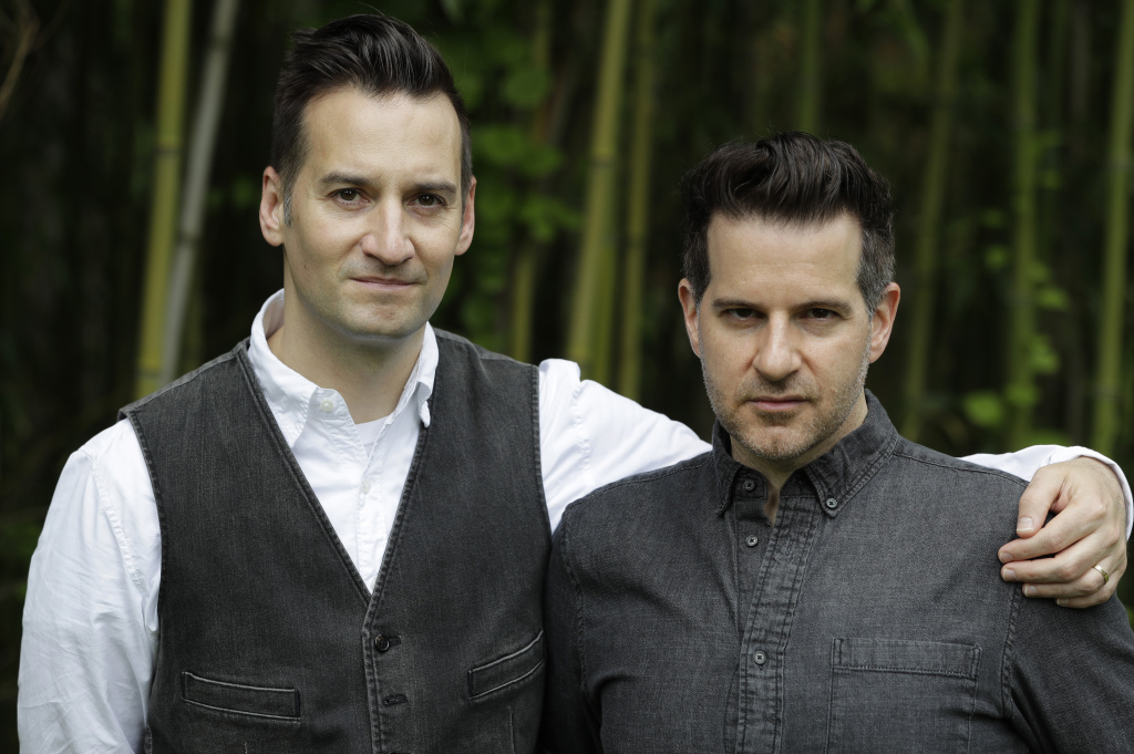 Tri Parenting In a Monday, May 29, 2017 photo, Sam Hunt, left, and his partner Darren Greenblatt pose for The Associated Press in their home in Princeton, N.J. The couple has a 7-year-old daughter with her biological mother, but things have not been easy, as the couple and the mother have fought over custody.