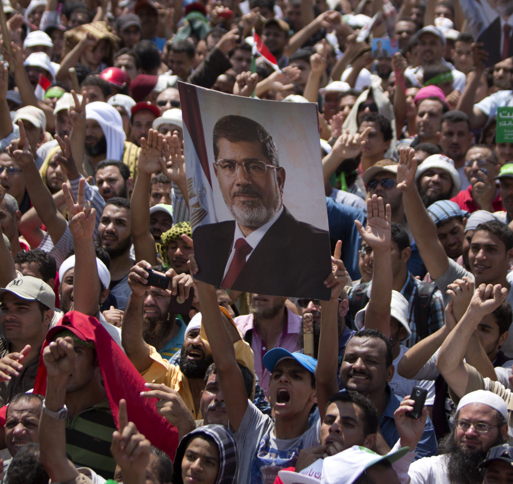 Supporters of the Muslim Brotherhood hold a picture of deposed President Mohammed Morsi during a rally outside Cairo's Rabaa al-Adawiya mosque on Friday.