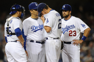 Manager Joe Torry, Russell Martin #55, pitcher Clayton Kershaw #22 and Casey Blake #23 have a meeting on the mound during the 2009 MLB Playoffs at Dodger Stadium on October 15, 2009 in Los Angeles, California.
