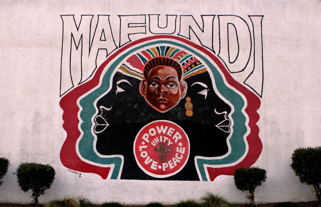 California Counts The Mafundi Institute mural on 103rd street in Watts. The historic building, long a hub of local arts and activism, is now home to the Mafundi auditorium and the Watts Coffee House and restaurant.