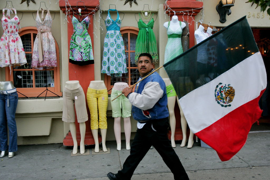 San Diego Rally Protests U.S. Immigration Raids A demonstrator walks through the Barrio Logan area during an immigration march on May 1, 2007 at Chican Park in San Diego, California.