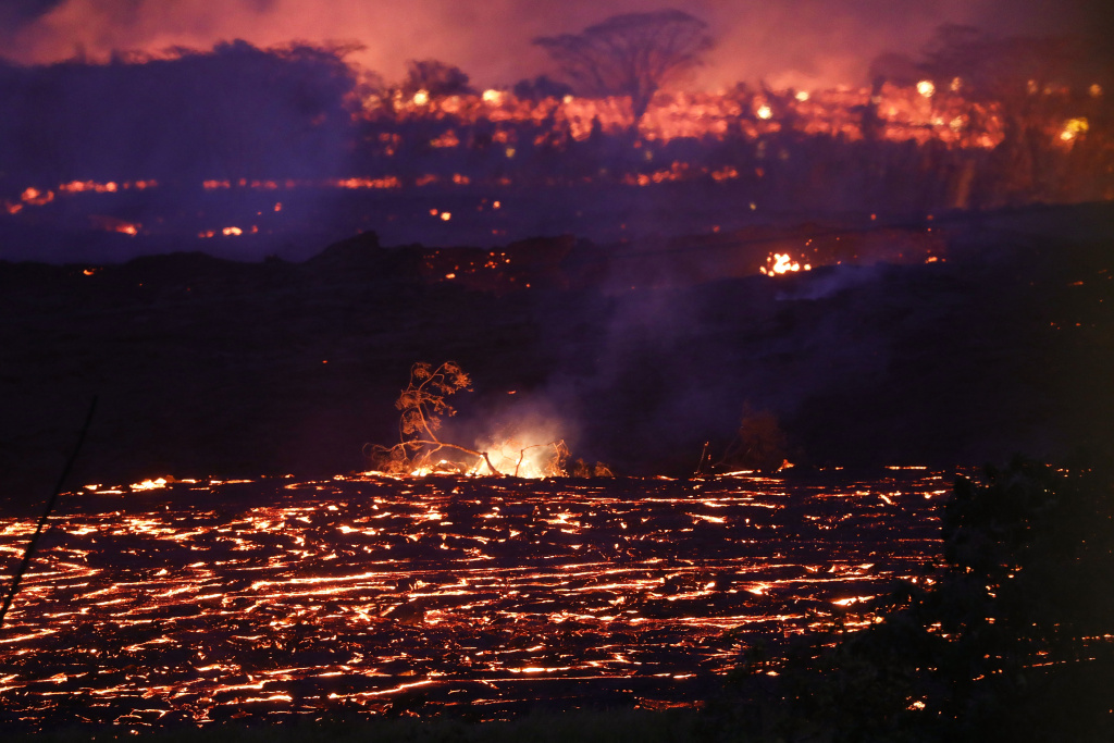 Hawaii's Kilauea Volcano Erupts Forcing Evacuations Lava from a Kilauea volcano fissure flows on Hawaii's Big Island on May 19, 2018 in Kapoho, Hawaii.