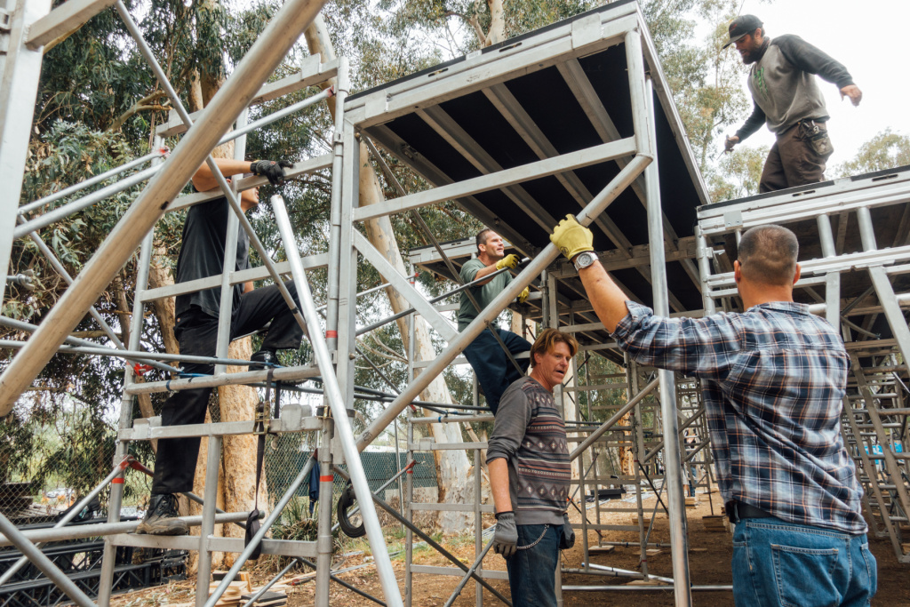 Shakespeare Henry IV Veteran - 8 Veterans in Arts program participants assemble stadium seating for the upcoming Henry IV production in the Japanese Garden on the West LA VA campus. Left-to-right: Kevin Lam, Bradley Wassil, Jeffrey Sonnenberg, Jonathan Willet.