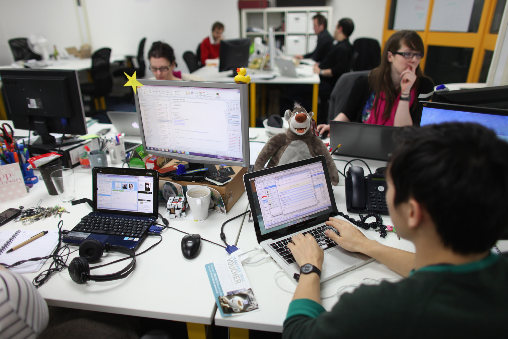 The Silicon Roundabout In Old Street People work at computers in TechHub, an office space for technology start-up entrepreneurs, near the Old Street roundabout in Shoreditch.