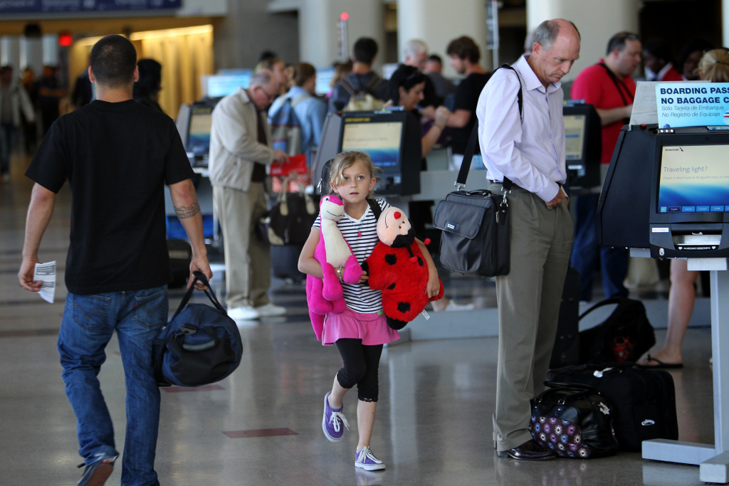Flight Delays Feared As Sequester Forces Air Traffic Controller Furloughs Passengers check in at Tom Bradley International Terminal at Los Angles International Airport (LAX) on April 22, 2013 in Los Angeles, California. Delays have been reported throughout the nation because of the furloughing of air traffic controllers under sequestration. The average delay overnight in the Southern California Terminal Radius Approach Control (TRACON) was was three hours.