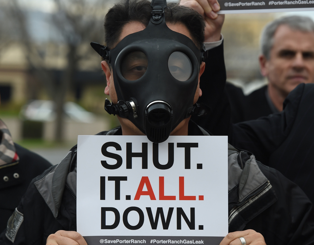 A Porter Ranch resident wears a gas mask during a protest Saturday outside a meeting of the Air Quality Management Board over the Aliso Canyon gas leak. While regulators have ordered the gas company to shut down the leaking well, some residents want the entire facility shuttered.