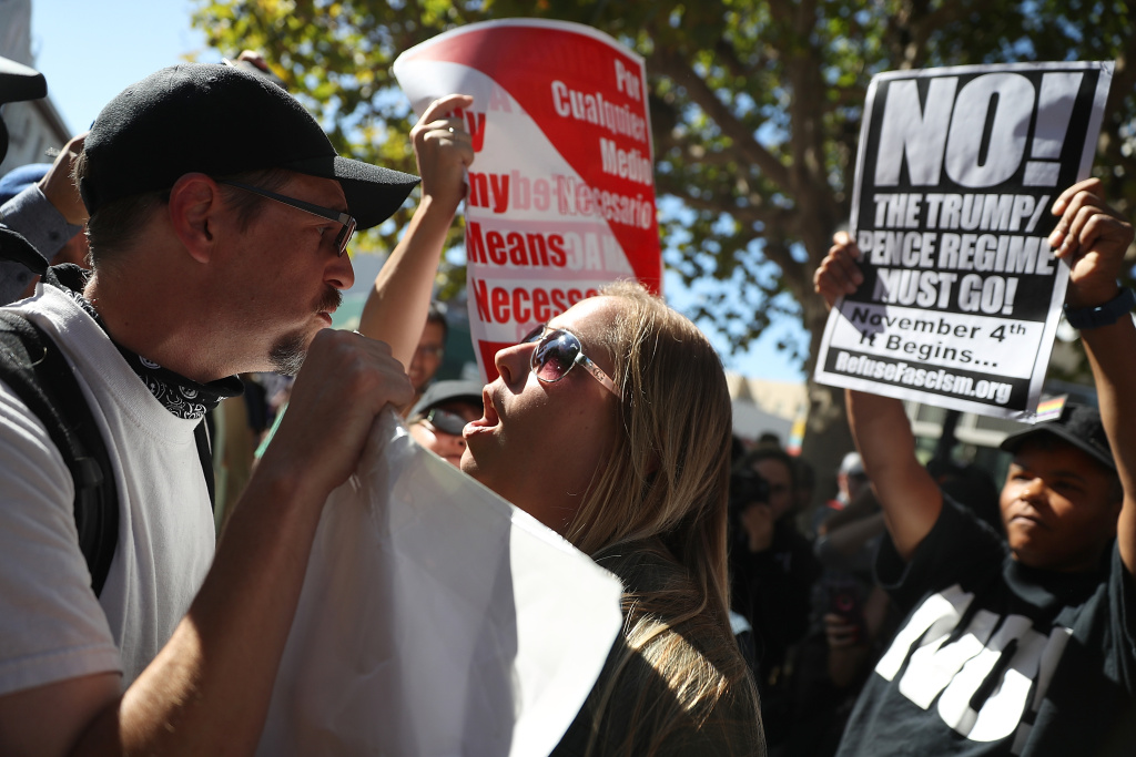 Right Wing Commentator Milo Yiannopoulos Gives Speech At Plaza In Berkeley BERKELEY, CA - SEPTEMBER 24: Protesters shout at each other during a free speech rally with right wing commentator Milo Yiannopoulos at U.C. Berkeley on September 24, 2017 in Berkeley, California. Hundreds of protesters came out to support and demonstrate against Milo Yiannopoulos as he held a free speech rally at U.C. Berkeley. (Photo by Justin Sullivan/Getty Images)