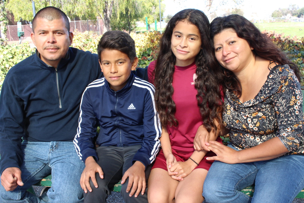 Crista Ramos sits on a park bench with dad Edgar Ramos, brother Diego and mom Cristina Morales in Richmond, Calif. on Nov. 4, 2018.
Crista Ramos sits on a park bench with dad Edgar Ramos, brother Diego and mom Cristina Morales in Richmond, Calif. on Nov. 4, 2018.