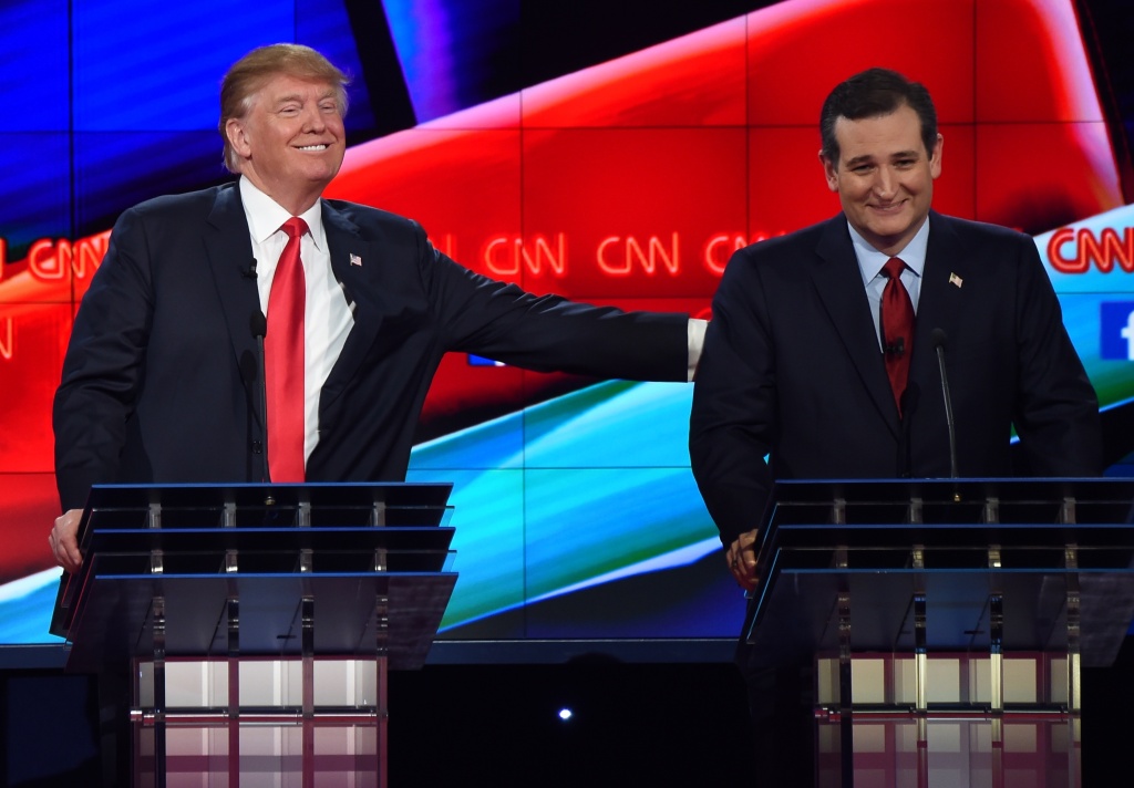 US-VOTE-REPUBLICANS-GOP-DEBATE Republican presidential candidate businessman Donald Trump (L) pat the back of Texas Sen. Ted Cruz during the Republican Presidential Debate, hosted by CNN, at The Venetian Las Vegas on December 15, 2015 in Las Vegas, Nevada. AFP PHOTO/ ROBYN BECK / AFP / ROBYN BECK (Photo credit should read ROBYN BECK/AFP/Getty Images)