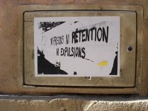 A poster in French reading "not prison, not retention, not expulsion (deportation)."