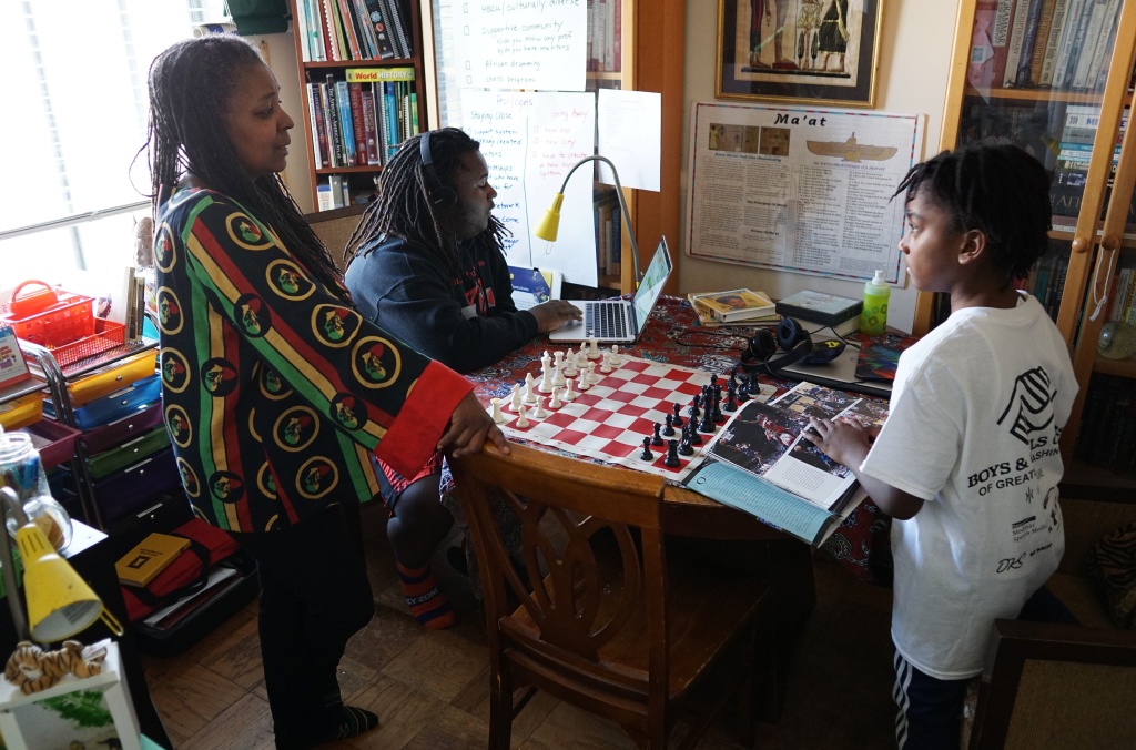 US-POLITICS-EDUCATION-HOME-SCHOOLING Monica Utsey, 49, is seen with her children Zion, 17, and Ayinde, 10, who she homes chools at her apartment in Washington, DC on February 24, 2017.