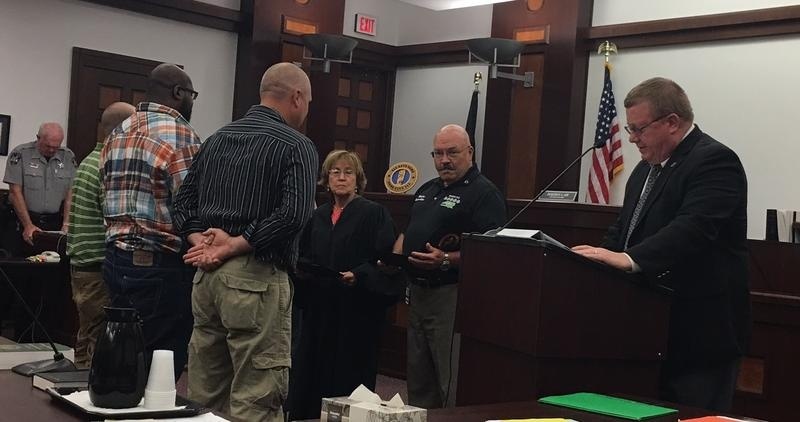 Veteran courts Three veterans stand before Judge Jacqueline L. Lee during their graduation ceremony from the Harnett County, N.C.Veterans Treatment Court.