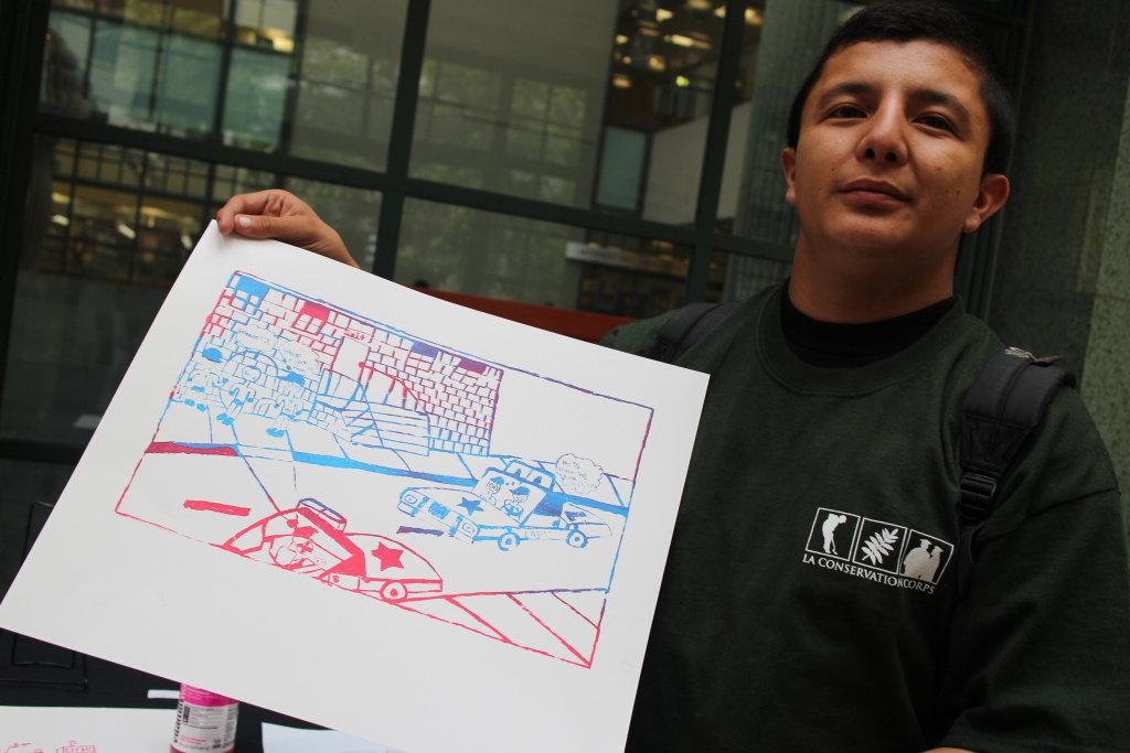 Raul Gomez, 18, goes to Saito High School. He made a screen print that depicts racial profiling. He appreciates art because, Raul Gomez, 18, goes to Saito High School. He made a screen print that depicts racial profiling. He appreciates art because,