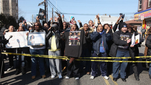 Fans mourn outside the funeral service for singer Whitney Houston in Newark, N.J., on Saturday. The pop superstar was found dead in a California hotel room a week ago. The cause of death has yet to be determined.