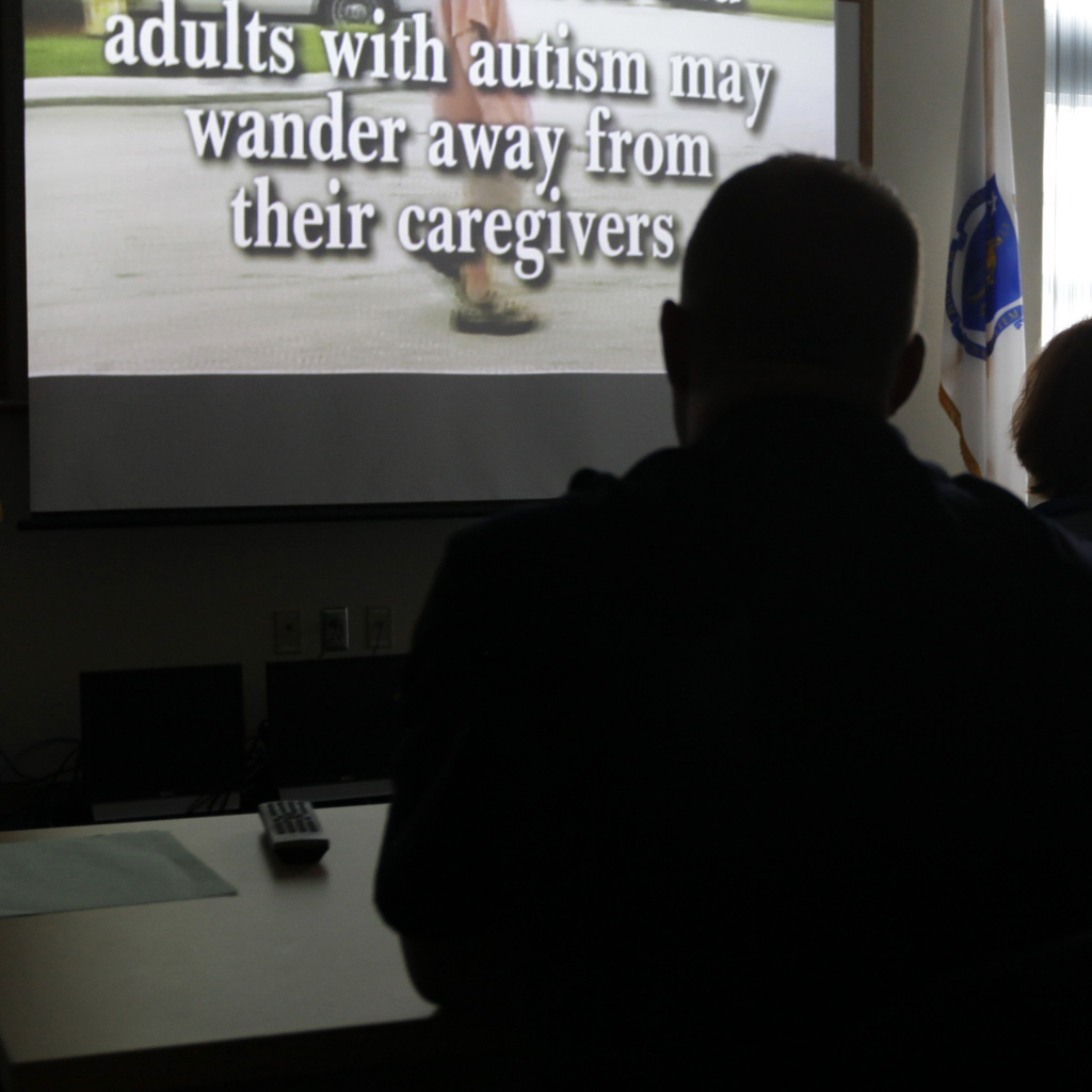 Police officers and other first responders attend a 2012 autism information training session in Wrentham, Mass. Several cities are working to reduce the risk of miscommunication between police officers and people with autism.