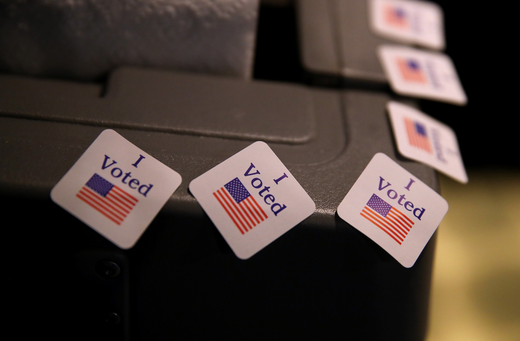 See KPCC's Human Voter Guide for more information on Tuesday's Primary. I voted stickers are displayed on a voting machine as democratic senatorial candidate Doug Jones casts his ballot at Brookwood Baptist Church on December 12, 2017 in Mountain Brook, Alabama.