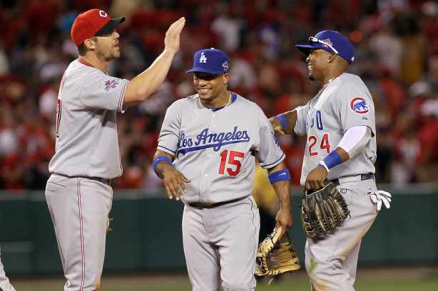 National League All-Star Scott Rolen #27 of the Cincinnati Reds, National League All-Star Rafael Furcal #15 of the Los Angeles Dodgers and National League All-Star Marlon Byrd #24 of the Chicago Cubs celebrate after their win in the 81st MLB All-Star Game at Angel Stadium of Anaheim on July 13, 2010 in Anaheim, California. The National League defeated the American League 3-1 for their first win the All-Star Game since 1996.