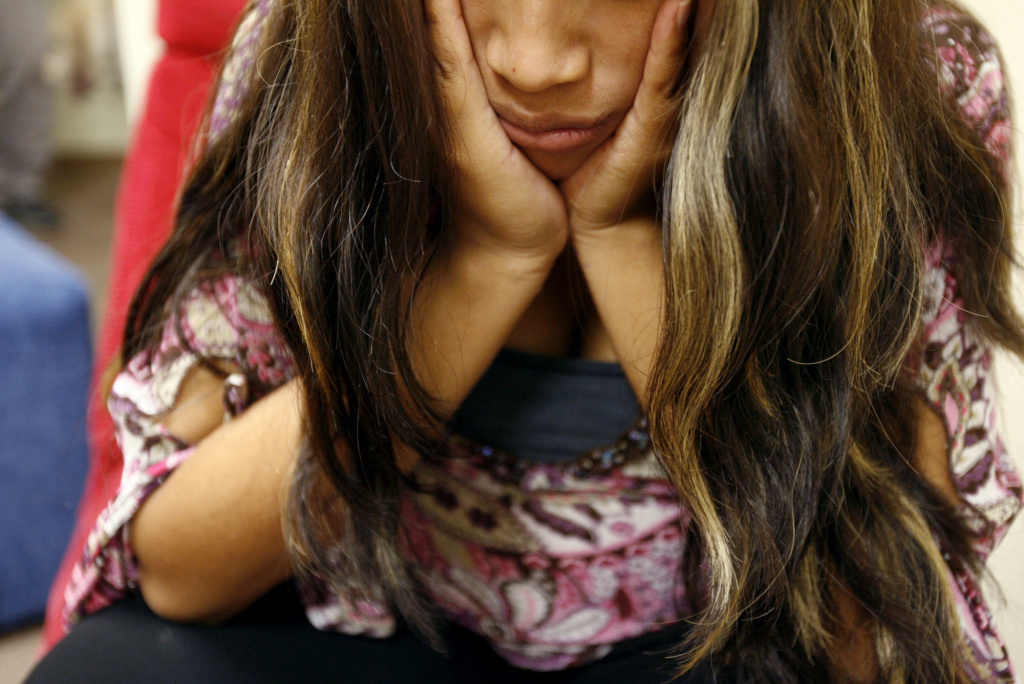 Immigrant shelters A young girl suffering from a sore tooth at a government-run shelter for immigrant children in Fullerton, Calif. With large temporary shelters closing, children will be going to smaller shelters like these.