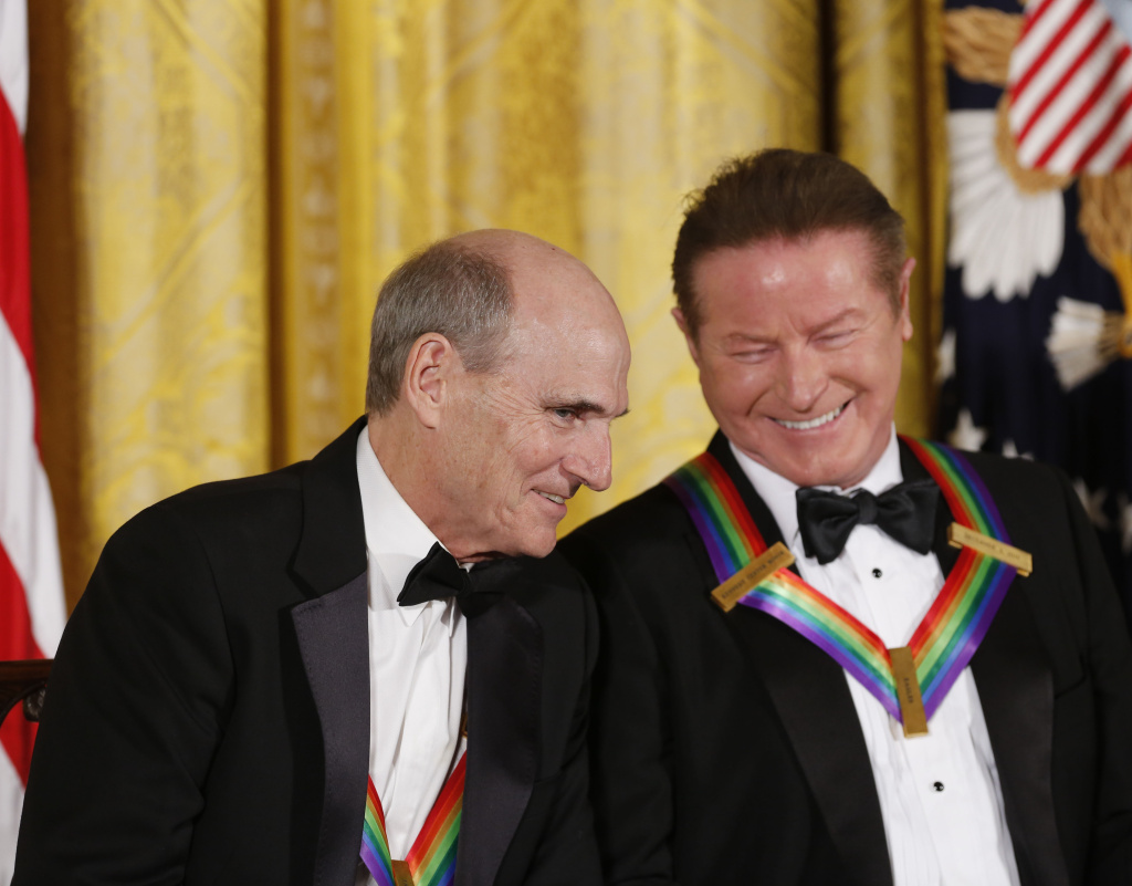 President Barack Obama Delivers Remarks At The Kennedy Center Honors Reception WASHINGTON, DC - DECEMBER 4: Singer James Taylor and Eagles band member Don Henley listen to President Barack Obama speak during a ceremony for the 2016 Kennedy Center honorees December 4, 2016 in the East Room of the White House in Washington, DC. The honorees include Eagles band members, actor Al Pacino, singer James Taylor, pianist Martha Argerich and singer Mavis Staples. (Photo by Aude Guerrucci-Pool/Getty Images)