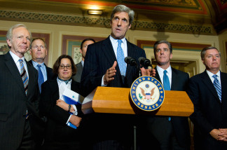 Senate Foreign Relations Chairman Senator John Kerry (C), D-MA, speaks to the media following a meeting with CEOs about climate change at the US Capitol in Washington, DC in 2009.