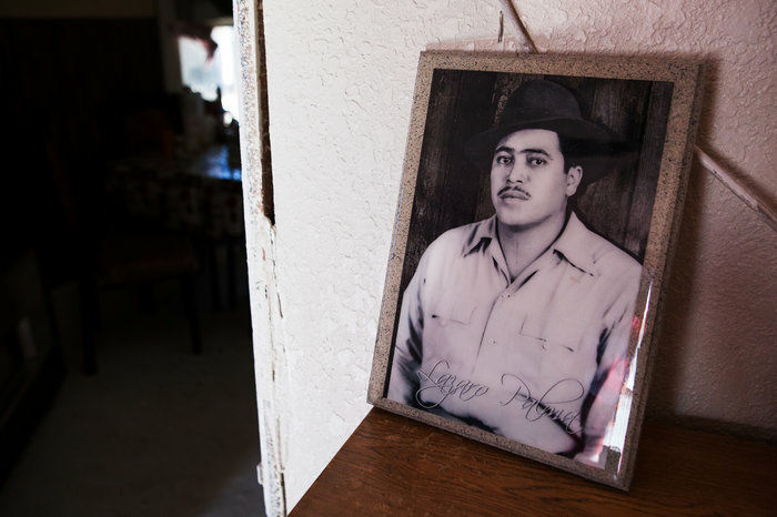 A portrait of Palma's maternal grandfather, Lazaro Moreno Palma, sits on top of a shelf in the family's living room. A portrait of Palma's maternal grandfather, Lazaro Moreno Palma, sits on top of a shelf in the family's living room.