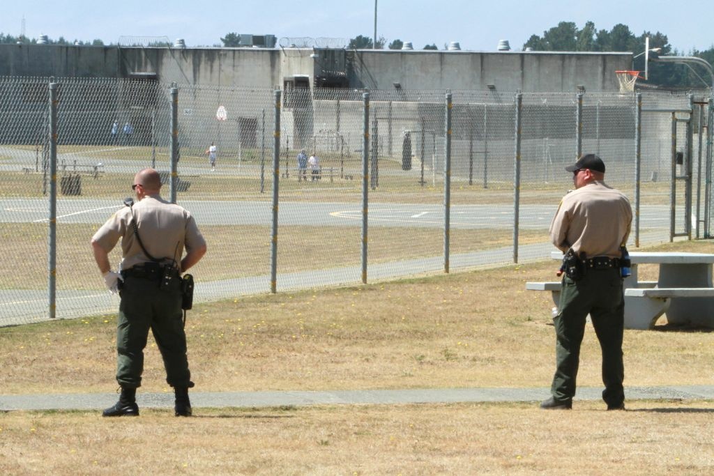 California Prisons Layoffs In this Aug. 17, 2011 file photo, correctional officers keep watch on inmates on the recreation yard.