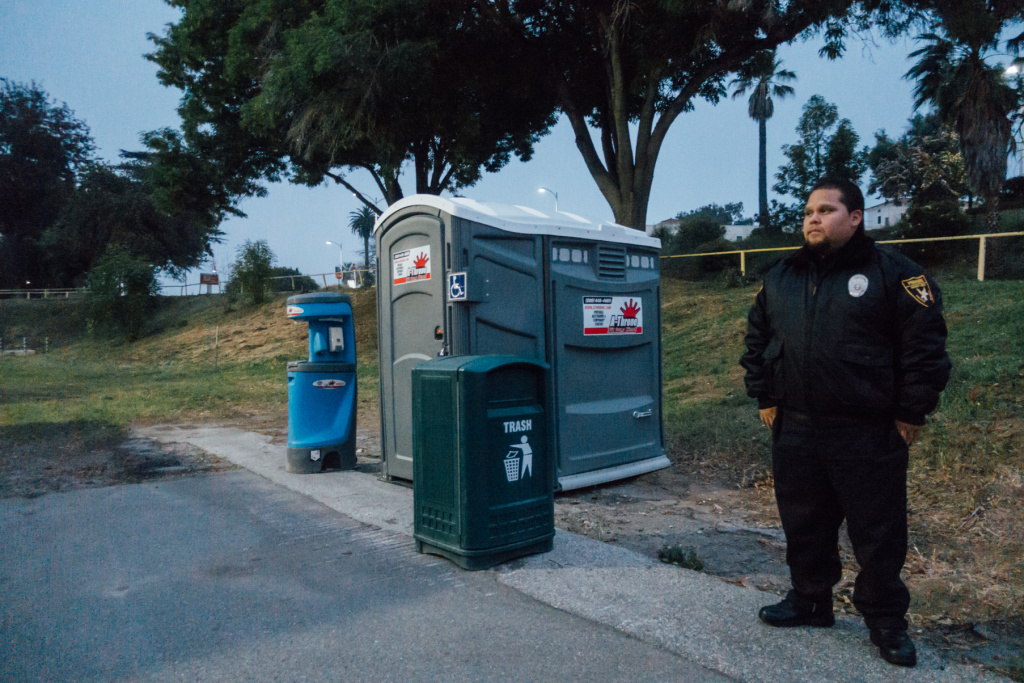Security Guard Safe Parking West LA VA Bill Garcia with Premiere Security Group stands watch at the lot designated for safe parking at the West L.A. VA campus.