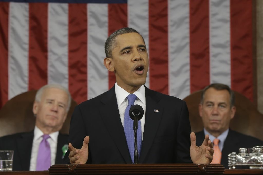US-POLITICS-OBAMA-STATE OF THE UNION President Barack Obama, flanked by Vice President Joe Biden and House Speaker John Boehner of Ohio, gestures during the State of the Union address before a joint session of Congress on Capitol Hill in Washington, Tuesday Feb. 12, 2013.