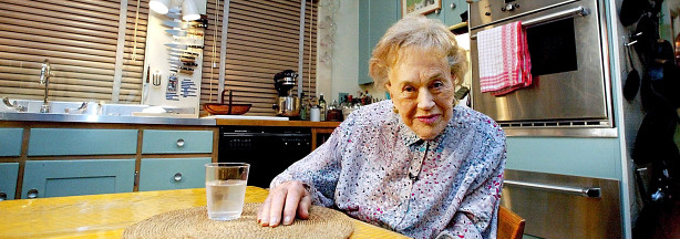 Mercer 5302 Julia Child sits in her kitchen on August 19, 2002, after it was moved from Cambridge, Massachusetts, and rebuilt as an exhibit marking her 90th birthday at the National Museum of American History in Washington, DC.