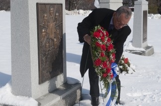 NASA Administrator Charles Bolden places a wreath at the memorial for the Challenger Space Shuttle at Arlington National Cemetery in Virginia on Jan. 27, 2011, to commemorate the agency's National Day of Remembrance.