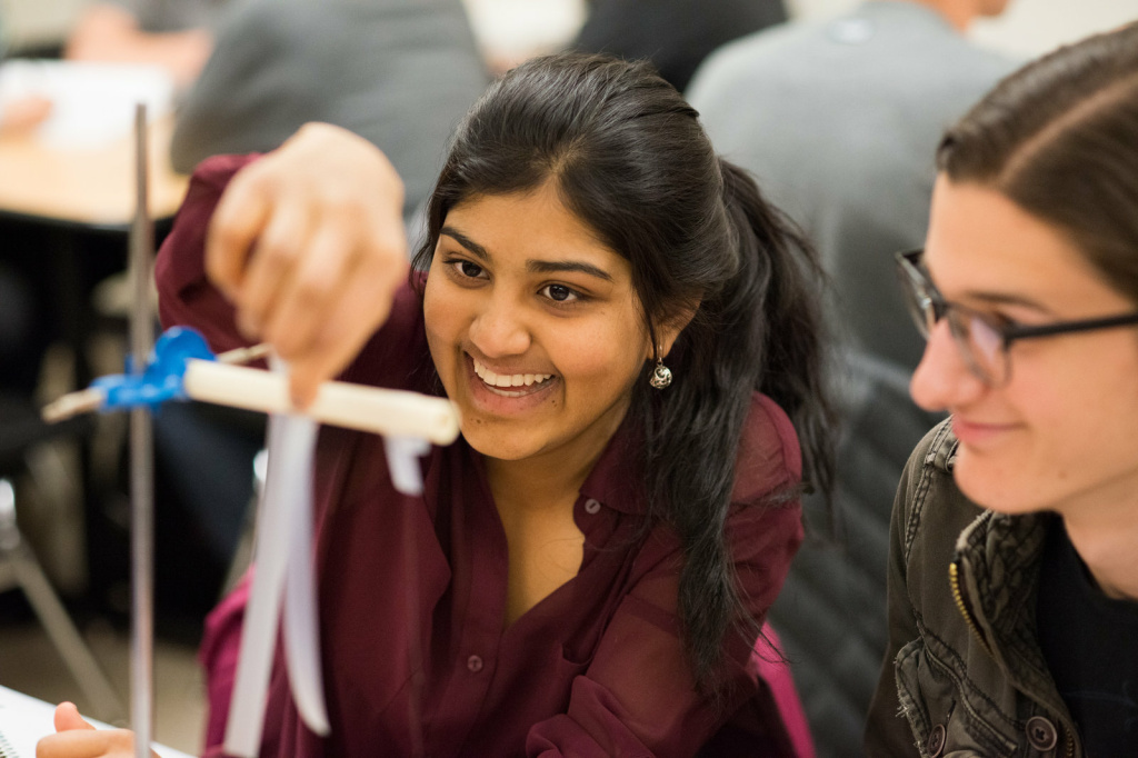 Students Geya Kairamkonda (left) and Patrick Murphy perform an experiment on electric charge using Scotch tape during a physics tutorial session. Their class uses learning assistants as tutors.
Students Geya Kairamkonda (left) and Patrick Murphy perform an experiment on electric charge using Scotch tape during a physics tutorial session. Their class uses learning assistants as tutors.