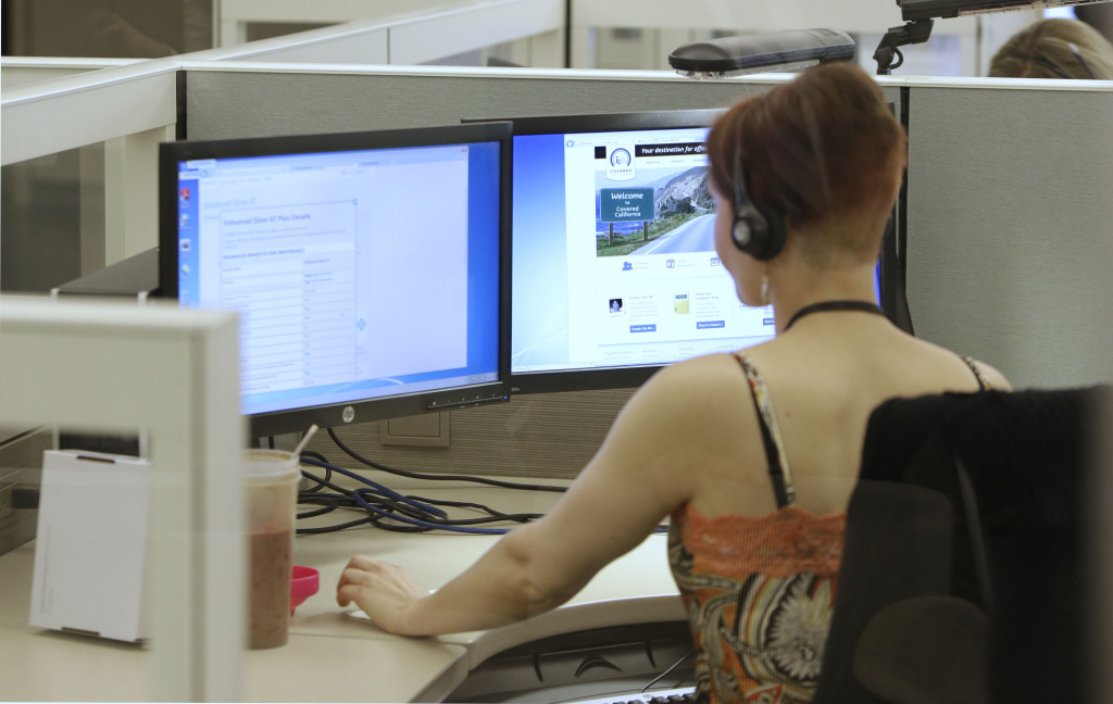 Health Overhaul California Gina Macaluso, an employee of Covered California, the state's new health care exchange, provides health insurance at the newly opened call center in Rancho Cordova, Calif., Tuesday, Oct. 1, 2013.