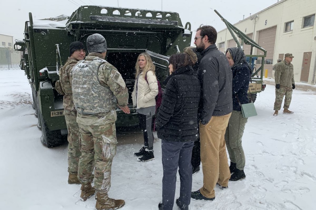American Homefront Teachers Discover Canyon High School Counselor Staci Wayant (center) joins other Colorado teachers on a tour of military vehicles on Fort Carson.
