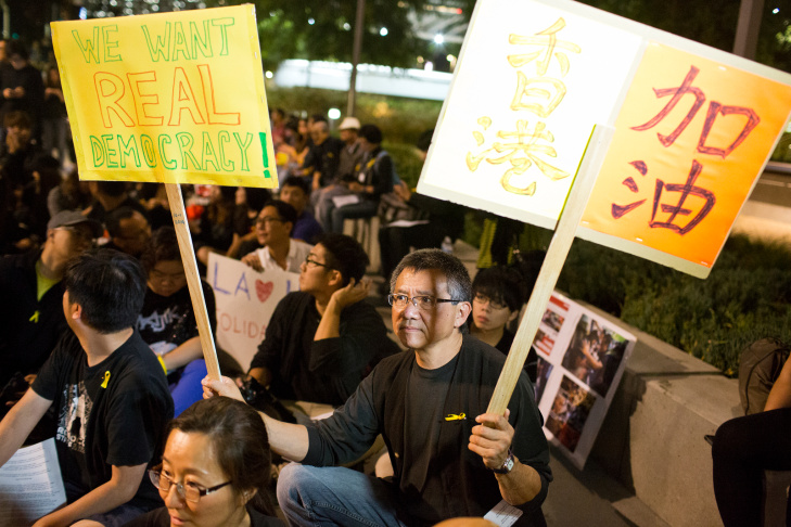 Hong Kong Forum Los Angeles organizer Donald Choy takes part during a vigil on Wednesday night, Oct. 1 at Grand Park in support of pro-democracy demonstrations happening in Hong Kong.