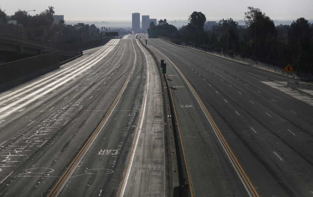 Southern California Wildfires Forces Thousands to Evacuate LOS ANGELES, CA - DECEMBER 06: Interstate 405 is deserted after being closed during rush hour in an area near the Skirball Fire on December 6, 2017 in Los Angeles, California. Strong Santa Ana winds are rapidly pushing multiple wildfires across the region, expanding across tens of thousands of acres and destroying hundreds of homes and structures. (Photo by Mario Tama/Getty Images)