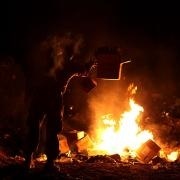 Burn_pit.jpg Marine Lance Cpl. Richard Carmichael disposes of trash in a burn pit in Afghanistan in this 2013 photo.