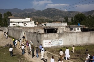 People gather outside Osama Bin Laden's compound, where he was killed during a raid by U.S. special forces, May 3, 2011 in Abottabad, Pakistan.