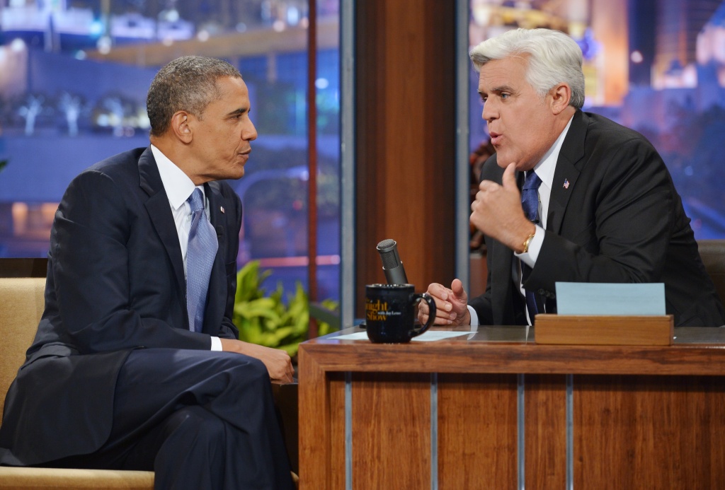 US-POLITICS-OBAMA US President Barack Obama chats with host Jay Leno during a taping of The Tonight Show with Jay Leno at NBC Studios on August 6, 2013 in Burbank, California.