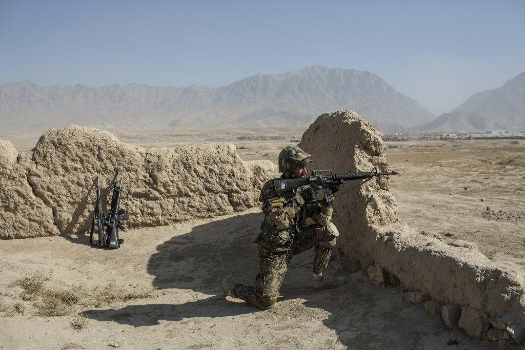 Kabul Military Training Center An Afghan National Army cadet secures the perimeter during a Taliban capture military exercise, overseen by French and Canadian soldiers, at the Kabul Military Training Center (KMTC) on November 13, 2012 in Kabul, Afghanistan. The ANA, with approximately 195,000 soldiers is experiencing difficult times, as about a third of the Afghan army is lost each year to desertion and low re-enlistment rates, news sources report. Additional vetting has been introduced since recent attacks on Western soldiers by members of the Afghan military. Deserters offer numerous reasons for leaving before their service is over: corruption, poor food and equipment, and Taliban intimidation of their families. The Kabul Military Training Center, conducts training between 10-24 weeks to prepare recruits for service.