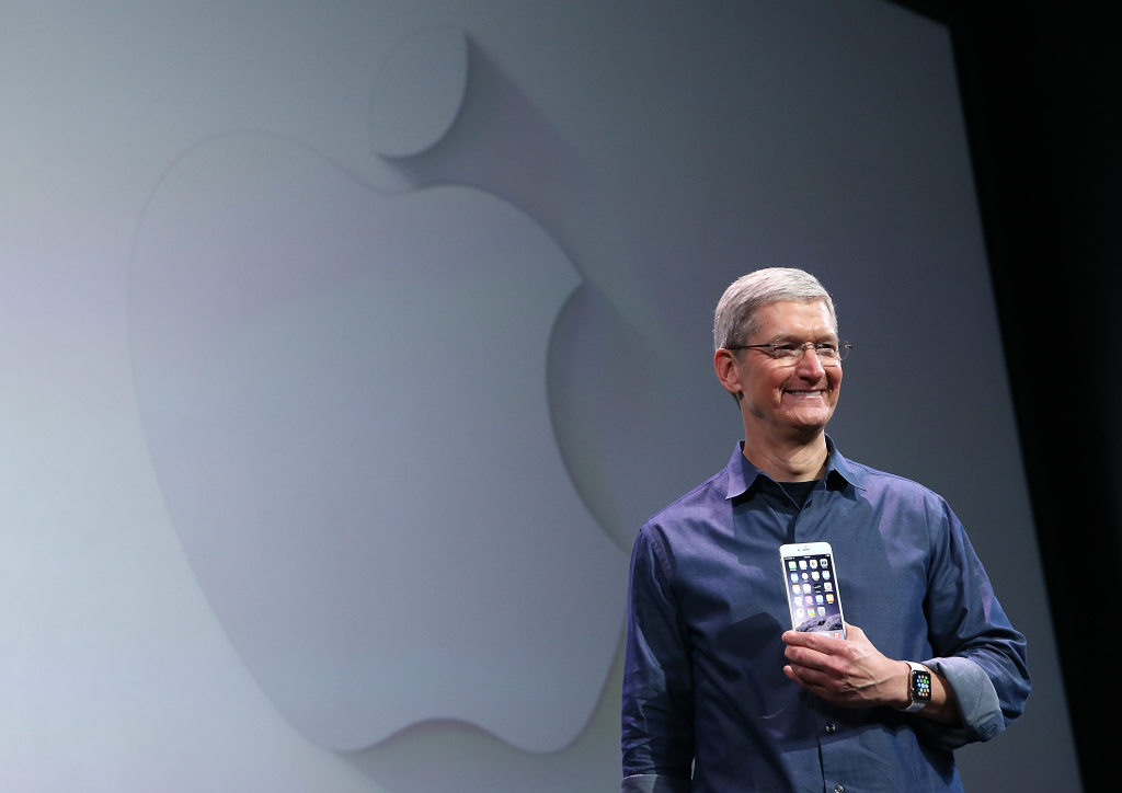 Apple Unveils iPhone 6 File: Apple CEO Tim Cook shows off the iPhone 6 and the Apple Watch during an Apple special event at the Flint Center for the Performing Arts on Sept. 9, 2014 in Cupertino.