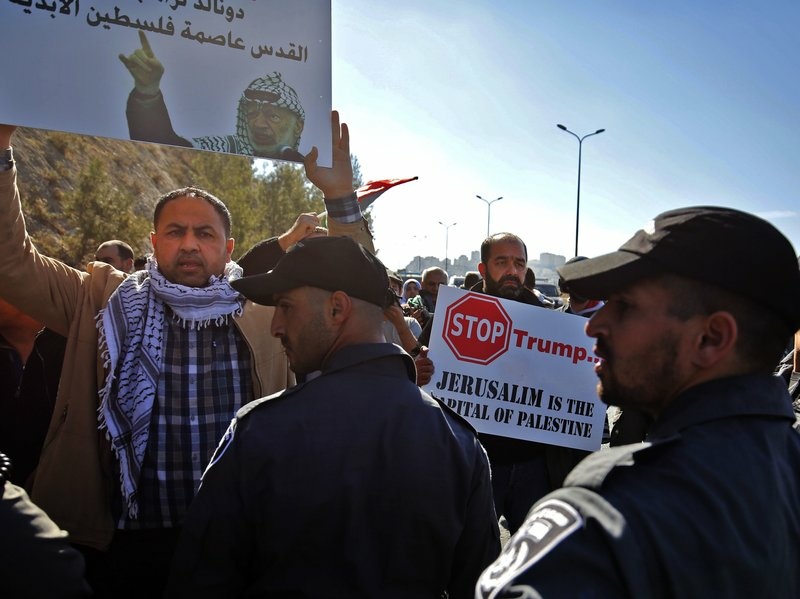 Palestinian protesters demonstrate against Trump and the construction of Jewish settlements in the occupied West Bank, near the Jewish settlement of Maale Adumim, east of Jerusalem, on Friday. Palestinian protesters demonstrate against Trump and the construction of Jewish settlements in the occupied West Bank, near the Jewish settlement of Maale Adumim, east of Jerusalem, on Friday.