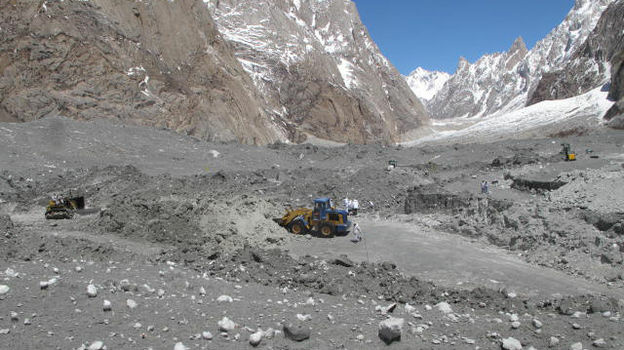 Pakistani soldiers work Wednesday at the site of an avalanche that buried 140 people, including 129 soldiers, April 7 on the Siachen glacier. The incident revived debate in Pakistan over the price of patrolling the frozen area in the Kashmir region along the Indian border.