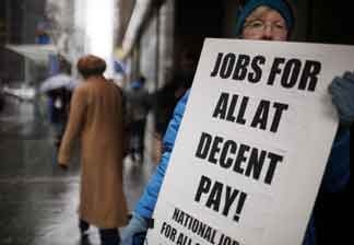 Sheila Collins protests with others outside of U.S. Senator Charles Schumer`s office to demand more jobs on April 1, 2011 in New York City. The U.S. Labor Department announced on Friday that the unemployment rate fell to 8.8 percent last month as the U.S. economy enjoyed a net gain of 216,000 new jobs.