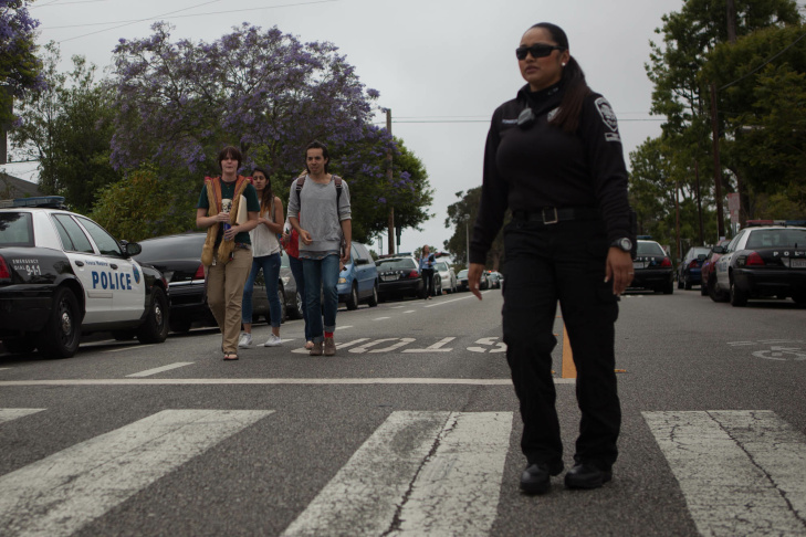 A student waits on the periphery of the Santa Monica College campus on Friday afternoon.